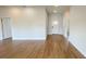 Spacious living area with light hardwood floors and view of the front door at 6741 Heavitree Dr, Sebring, FL 33876
