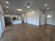 Bright living room showcasing the vinyl floors and the open concept leading into the kitchen at 6741 Heavitree Dr, Sebring, FL 33876