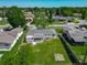 Aerial view of home with large backyard, mature trees, and an enclosed patio at 8228 Shriver Dr, Orlando, FL 32822