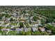 Wide aerial shot of a residential area showcasing cozy homes and curved streets surrounded by lush greenery at 8228 Shriver Dr, Orlando, FL 32822