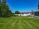 Lawn extending from the rear of the house and screened in patio at 8228 Shriver Dr, Orlando, FL 32822