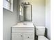Bathroom featuring a white vanity, square mirror, and a standard toilet at 8228 Shriver Dr, Orlando, FL 32822