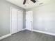 Bright bedroom features a ceiling fan and closet for ample storage at 8228 Shriver Dr, Orlando, FL 32822