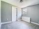 The bedroom is well lit and includes a window and a closet at 8228 Shriver Dr, Orlando, FL 32822