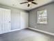 The bright bedroom provides ample closet space and natural light from the window at 8228 Shriver Dr, Orlando, FL 32822