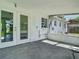 View of back enclosed patio with view into the home through glass doors at 8228 Shriver Dr, Orlando, FL 32822