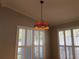 Close-up of hanging light fixture featuring stained glass and intricate metalwork at 8532 Bay Springs Dr, Orlando, FL 32819