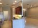 Bright kitchen featuring an open layout, breakfast bar, and ample cabinet space at 8532 Bay Springs Dr, Orlando, FL 32819