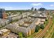 Stunning aerial view of the apartment complex surrounded by city skyline and lush greenery with easy access to transport links at 860 N Orange Ave # 306, Orlando, FL 32801