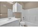 Bright bathroom with white cabinets, single sink vanity, shower and tub combination at 860 N Orange Ave # 306, Orlando, FL 32801