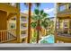 Balcony view of tropical landscaping and pool on a sunny day at 860 N Orange Ave # 306, Orlando, FL 32801