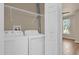 Laundry area with full size washer and dryer, and wire shelving at 860 N Orange Ave # 306, Orlando, FL 32801