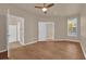 Spacious main bedroom with wooden floors, natural light, and an ensuite bathroom, perfect for relaxation at 860 N Orange Ave # 306, Orlando, FL 32801