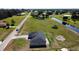 A lovely new home with a large yard, driveway, and water view from above at 8600 Castile Rd, Sebring, FL 33876