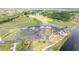 Beautiful aerial view of the clubhouse with plenty of parking and manicured landscaping at 8600 Castile Rd, Sebring, FL 33876