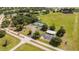 Wide aerial view showcasing community courts with seating and a nearby parking area and community center at 8600 Castile Rd, Sebring, FL 33876