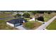 An aerial view of a charming single Gathering home with a spacious front yard at 8600 Castile Rd, Sebring, FL 33876