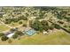 Beautiful community aerial view with walking trails, tennis courts, and lovely landscaping at 8600 Castile Rd, Sebring, FL 33876