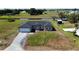 An aerial view of a charming single Gathering home with a spacious front yard at 8600 Castile Rd, Sebring, FL 33876