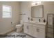 Modern bathroom with double vanity, sleek black fixtures, and bright lighting provides a clean aesthetic at 8600 Castile Rd, Sebring, FL 33876