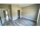 Bright bedroom with hardwood floors, closet, and neutral paint at 8600 Castile Rd, Sebring, FL 33876