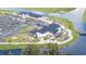 Aerial view of the community clubhouse featuring ample parking, a spacious deck, and waterfront access at 8600 Castile Rd, Sebring, FL 33876