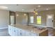 Bright kitchen showcasing a large island with modern pendant lighting at 8600 Castile Rd, Sebring, FL 33876