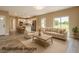 Open concept living room with modern kitchen, ample natural light, and stylish contemporary furnishings at 8600 Castile Rd, Sebring, FL 33876