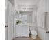 All-white bathroom featuring an updated vanity, sink, and shower/tub combo at 8801 Latrec Ave # 8101, Orlando, FL 32819