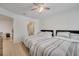 Bedroom featuring hardwood floors, two beds, and an en-suite bathroom at 8801 Latrec Ave # 8101, Orlando, FL 32819