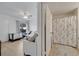 Comfortable bedroom featuring a window, and access to a bathroom, creating a functional and versatile space at 8801 Latrec Ave # 8101, Orlando, FL 32819
