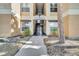 Exterior view of building entrance with walkway, stairs, and neutral color scheme at 8801 Latrec Ave # 8101, Orlando, FL 32819