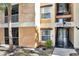 Exterior of building featuring balconies, stairs, and neutral two-tone color scheme at 8801 Latrec Ave # 8101, Orlando, FL 32819