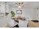 Chic dining area with a round table, comfortable seating, and a view of the modern kitchen at 8801 Latrec Ave # 8101, Orlando, FL 32819