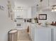 Bright kitchen showcasing white cabinetry, stainless steel appliances, and stylish pendant lighting at 8801 Latrec Ave # 8101, Orlando, FL 32819