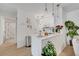 Modern kitchen featuring white cabinets, quartz countertops, pendant lighting, and stainless steel appliances at 8801 Latrec Ave # 8101, Orlando, FL 32819