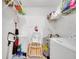 Practical laundry room with appliances, shelving, and storage, providing convenience and organization at 8801 Latrec Ave # 8101, Orlando, FL 32819