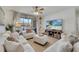Comfortable living room featuring hardwood floors, comfortable seating, and a flat-screen television at 8801 Latrec Ave # 8101, Orlando, FL 32819
