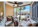 Cozy screened patio features comfortable seating and a ceiling fan, perfect for relaxing outdoors at 8801 Latrec Ave # 8101, Orlando, FL 32819