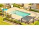 Community swimming pool featuring shaded lounge area and nearby lush landscaping at 8801 Latrec Ave # 8101, Orlando, FL 32819