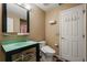 Modern bathroom with glass sink, unique toilet, and storage shelves for added convenience at 9128 Phillips Grove Ter, Orlando, FL 32836