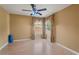 Bedroom featuring tile floors, neutral paint, and two large windows that offer natural light at 9128 Phillips Grove Ter, Orlando, FL 32836