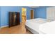 The bedroom features a matching dresser set and attached bathroom at 9128 Phillips Grove Ter, Orlando, FL 32836