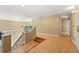 A view from the top of the staircase to the landing and entrance foyer at 9128 Phillips Grove Ter, Orlando, FL 32836