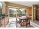 A well-lit kitchen area with a breakfast table and a large window overlooking the outdoor area at 9128 Phillips Grove Ter, Orlando, FL 32836