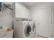Bright laundry room featuring a modern washer and dryer set at 9128 Phillips Grove Ter, Orlando, FL 32836