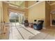 Bright living room with tile flooring, neutral walls, floor-to-ceiling windows, and comfortable seating at 9128 Phillips Grove Ter, Orlando, FL 32836
