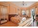 Bedroom with natural light shining through the bay window and sliding glass door at 9128 Phillips Grove Ter, Orlando, FL 32836