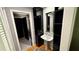 Stylish bathroom with a modern pedestal sink, unique storage cabinet, and neutral-toned walls at 954 N Texas Ave, Orlando, FL 32804