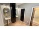 Modern bathroom with double pedestal sinks, stylish mirrors, and a glass-enclosed shower at 954 N Texas Ave, Orlando, FL 32804